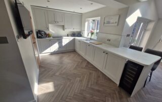 Completed kitchen The completed kitchen with the grey units, stunning flooring and new windows - all of the work done by MW Construction